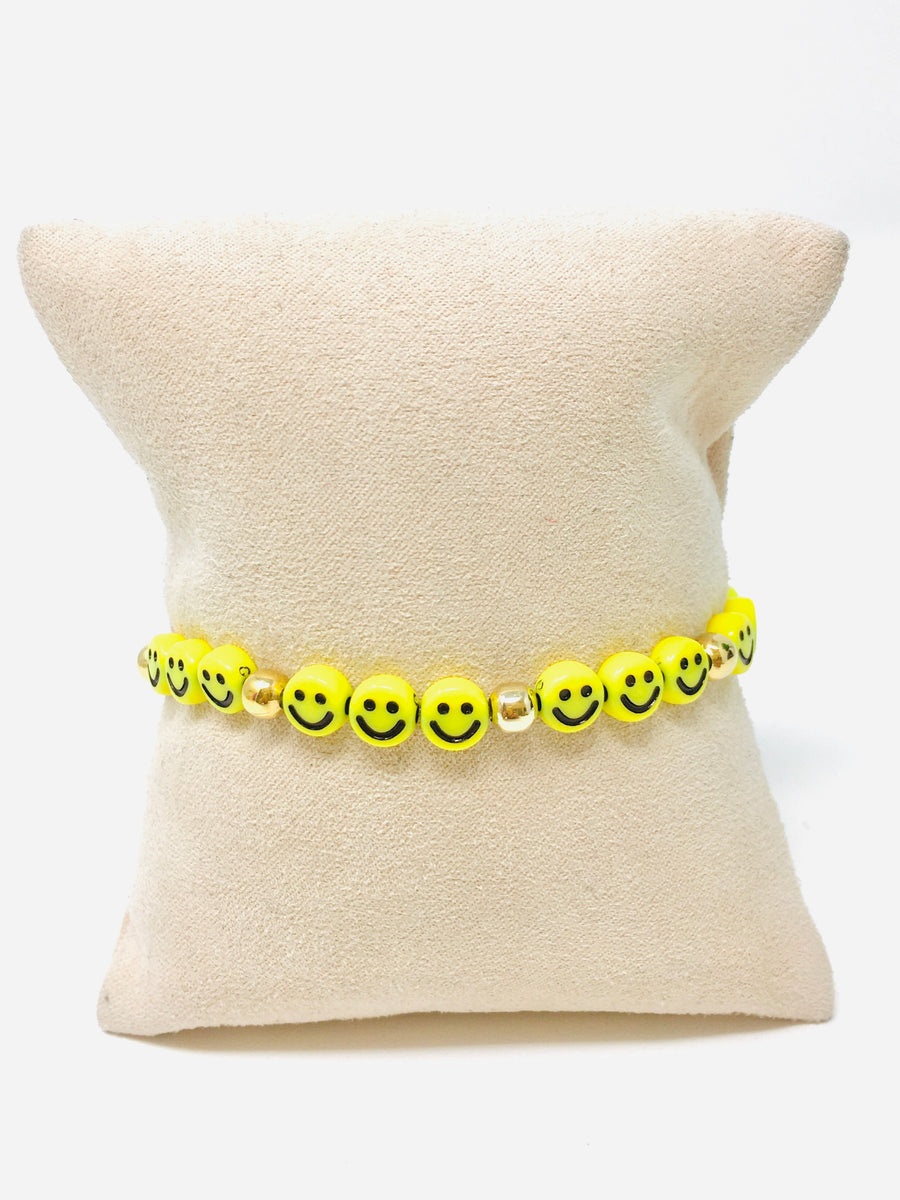 PULSERA CARITA FELIZ BOLITA DORADA